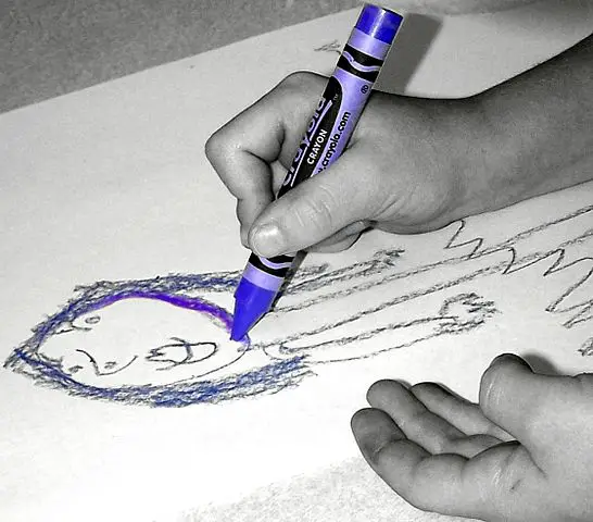 Child learning to draw